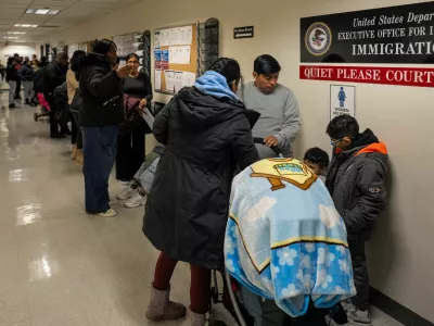 Respondents wait to enter their hearings at the U.S. Immigration Court in Manhattan, in New York City, U.S., December 2, 2025. REUTERS/David 'Dee' Delgado