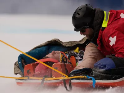 Slovenia's Rok Elezi Aznoh is brought down on a sled after a crash while competing during a World Cup men's downhill skiing race, Thursday, Dec. 4, 2025, in Beaver Creek, Colo. (AP Photo/Robert F. Bukaty)