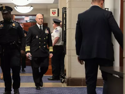 U.S. Navy Admiral Frank "Mitch" Bradley walks in a hallway, as he departs a classified briefing for leaders of the Senate Armed Services Committee on U.S. strikes against Venezuelan boats suspected of smuggling drugs, on Capitol Hill in Washington, D.C., U.S., December 4, 2025. REUTERS/Jonathan Ernst