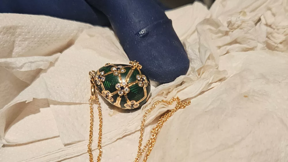 In this photo provided by the New Zealand Police a Faberg&eacute; pendant is held after it was recovered, Thursday, Dec. 4, 2025, from a man accused of stealing and swallowing the pendant. (New Zealand Police via AP)