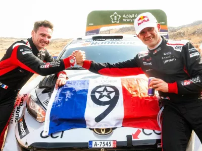 S&eacute;bastien Ogier secured his ninth FIA World Rally Championship title after a decisive Asfan surge put the championship in his hands, equalling S&eacute;bastien Loeb's record and earning co-driver Vincent Landais his first world crown. Thierry Neuville clinched his first win of the season in Saudi Arabia by 54.7 seconds, while Elfyn Evans missed the title by just four points in one of the closest finishes in recent WRC history. // S&eacute;bastien Ogier (FRA) and Vincent Landais (FRA) of team TOYOTA GAZOO RACING WRT celebrate World Rally Championship 2025 title during stop 14 of the World Rally Championship in Jeddah, Saudi Arabia on November 29, 2025. // Jaanus Ree / Red Bull Content Pool via AP Images // For more content, pictures and videos like this please go to http://www.redbullcontentpool.com