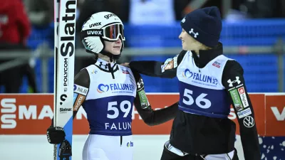 Nika Prevc, of Slovenia, left, and Nika Vodan, of Slovenia, react after completing the women's Individual HS95 FIS World Cup Ski Jumping event in Falun, Sweden, Friday, Nov. 28, 2025. (Fredrik Sandberg/TT News Agency via AP)