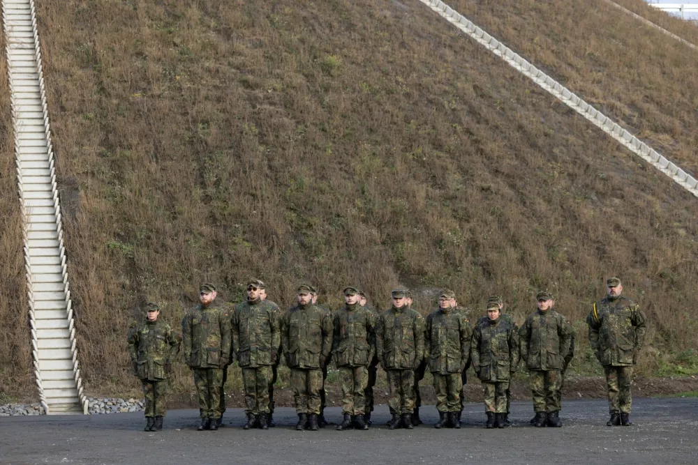 Soldiers stand in front of the "Arrow Weapon System for Germany", in Annaburg, G