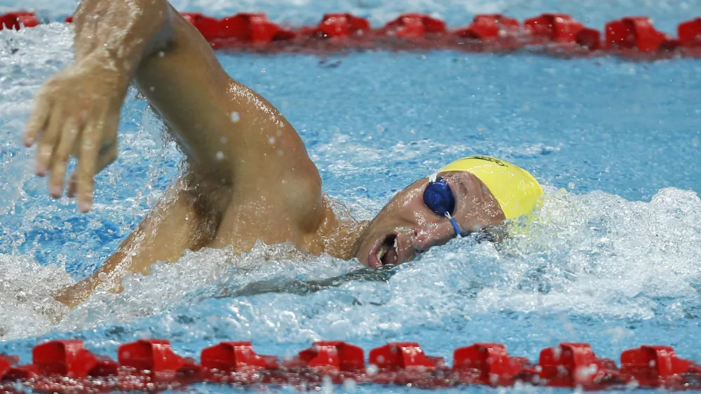 Former Olympic swimming champion Ian Thorpe of Australia competes in Men's 100 meter freestyle heat at the FINA-ARENA Swimming World Cup in Beijing, China, Tuesday, Nov. 8, 2011. Thorpe failed to qualify for the 100 meter freestyle final. (AP Photo/Alexander F. Yuan)