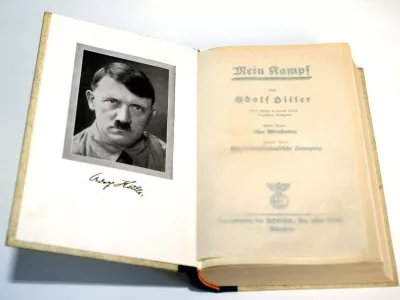 (dpa) - A copy of the first edition of Adolf Hitler's 'Mein Kampf' (My Struggle) features a frontispiece of the Fuehrer, pictured in Germany, 2003. In 1923 Adolf Hitler was arrested for attempting to overthrow the government in Munich and his National Socialist German Workers' Party (the Nazi party NSDAP) was disbanded. While in prison he wrote the first volume of 'Mein Kampf', outlining his political ideas. 'Mein Kampf' was not taken seriously at first, but it includes many of the ideas the Nazis put in practice in the 1930s and 1940s.,Image: 676250941, License: Rights-managed, Restrictions:, Model Release: no