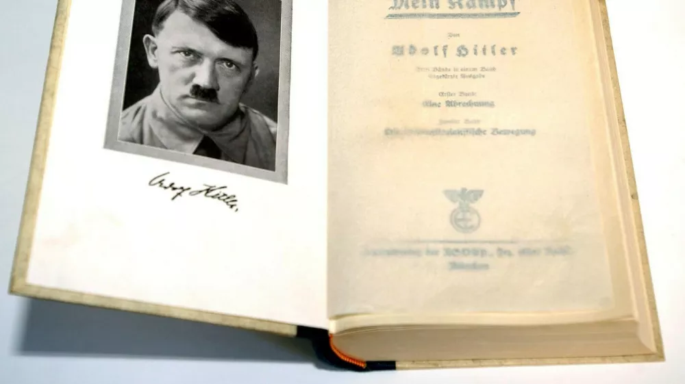 (dpa) - A copy of the first edition of Adolf Hitler's 'Mein Kampf' (My Struggle) features a frontispiece of the Fuehrer, pictured in Germany, 2003. In 1923 Adolf Hitler was arrested for attempting to overthrow the government in Munich and his National Socialist German Workers' Party (the Nazi party NSDAP) was disbanded. While in prison he wrote the first volume of 'Mein Kampf', outlining his political ideas. 'Mein Kampf' was not taken seriously at first, but it includes many of the ideas the Nazis put in practice in the 1930s and 1940s.,Image: 676250941, License: Rights-managed, Restrictions:, Model Release: no