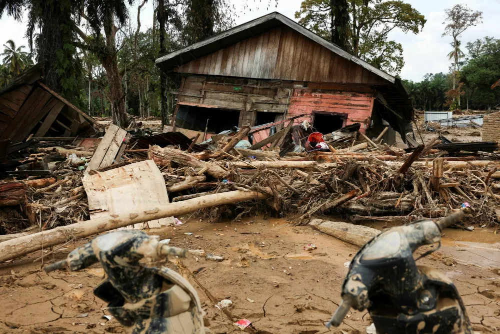 An heavily damaged house sits among debris following deadly flash flood in Batang Toru, South Tapanuli, North Sumatra province, Indonesia, December 6, 2025. REUTERS/Willy Kurniawan