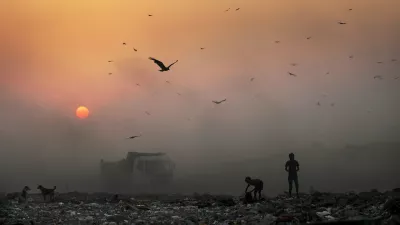 A thick blanket of smoke is seen against the setting sun as young ragpickers search for reusable material at a garbage dump in New Delhi, India, Friday, Oct. 17, 2014. India launched the Air Quality Index Friday to measure air quality across the nation that is home to some of the most polluted cities in the world. It will measure eight major pollutants that impact respiratory health in cities with populations exceeding 1 million in the next five years and then gradually the rest of the country, Environment Minister Prakash told reporters. The World Health Organization said earlier this year that the Indian capital had the worst air quality in the world, surpassing Beijing, a statement that New Delhi has vehemently disputed. (AP Photo/Altaf Qadri)