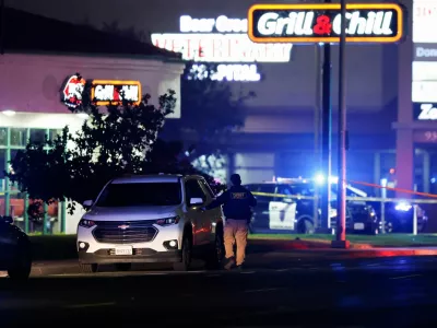 A police officer checks a vehicle after several people were shot at a family gathering in Stockton, California, U.S. November 29, 2025. REUTERS/Fred Greaves