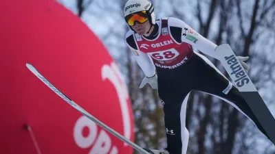 Domen Prevc of Slovenia soars through the air during his first round jump of the ski jumping Men's Large Hill HS134 event at the FIS Ski Jumping World Cup in Wisla, Poland, Sunday, Dec. 7, 2025. (AP Photo/Czarek Sokolowski)