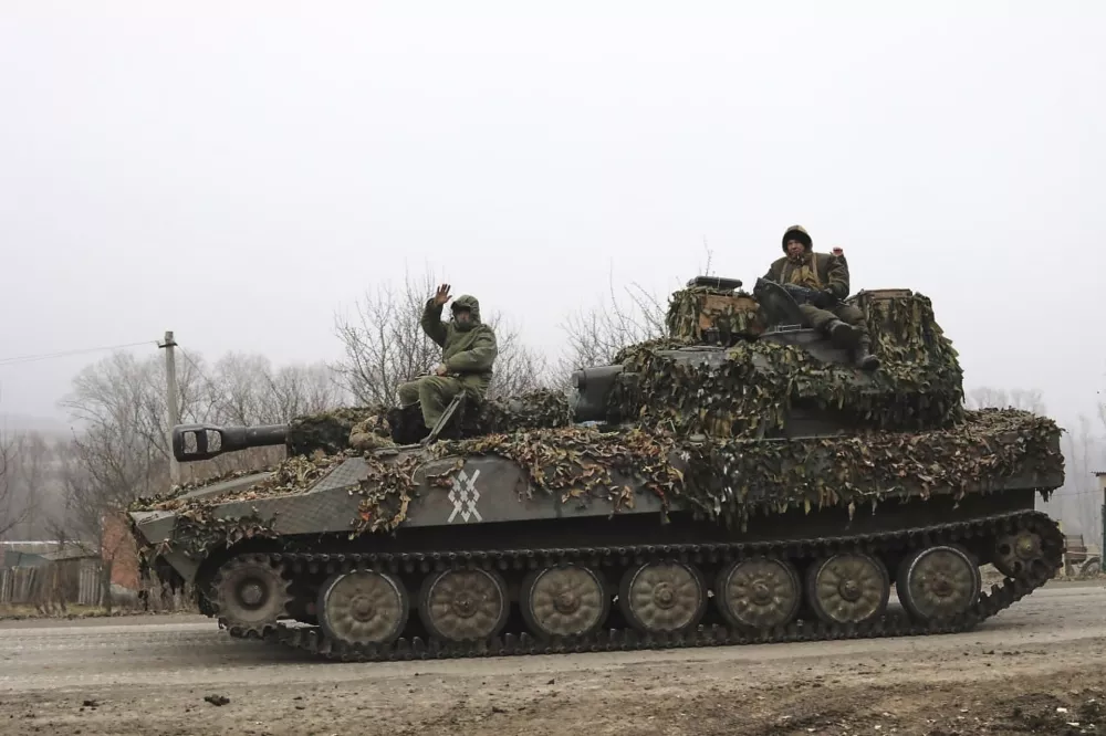FILE - In this image made from a video distributed by the Russian Defense Ministry Press Service on Friday, March 14, 2025, Russian soldiers ride on a self-propelled gun in Russia's Kursk region. (Russian Defense Ministry Press Service via AP, File)