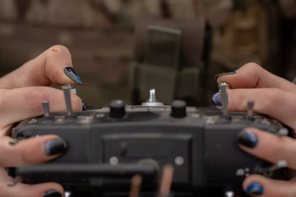 Monka, a Ukrainian FPV drone operator from the third assault brigade, pilots an FPV drone during a demonstration for The Associated Press, Wednesday, Nov. 5, 2025, in Kharkiv Oblast, Ukraine. (AP Photo/Julia Demaree Nikhinson)