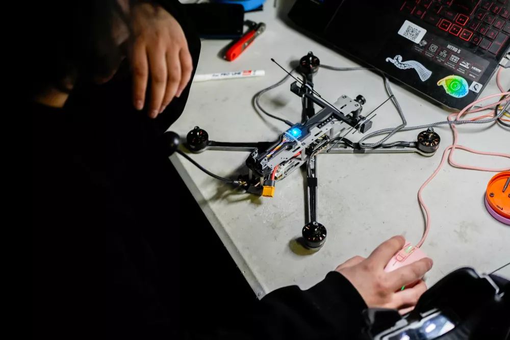 Chibi, a Ukrainian soldier from the Khartia brigade, tests a drone, Friday, Nov. 7, 2025, in Kharkiv Oblast, Ukraine. (AP Photo/Julia Demaree Nikhinson)