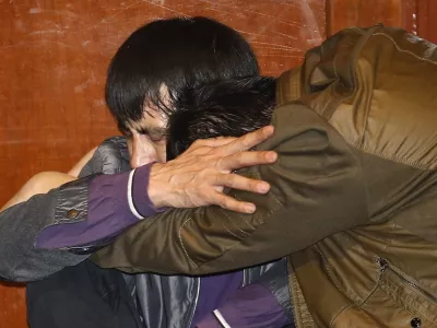 Family members of passengers aboard Malaysia Airlines MH370 cry after watching a television broadcast of a news conference, in the Lido hotel in Beijing, March 24, 2014. The Malaysia Airlines plane that disappeared over two weeks ago crashed in the southern Indian Ocean, Malaysia's Prime Minister Najib Razak said on Monday. REUTERS/Kim Kyung-Hoon (CHINA - Tags: TRANSPORT DISASTER)