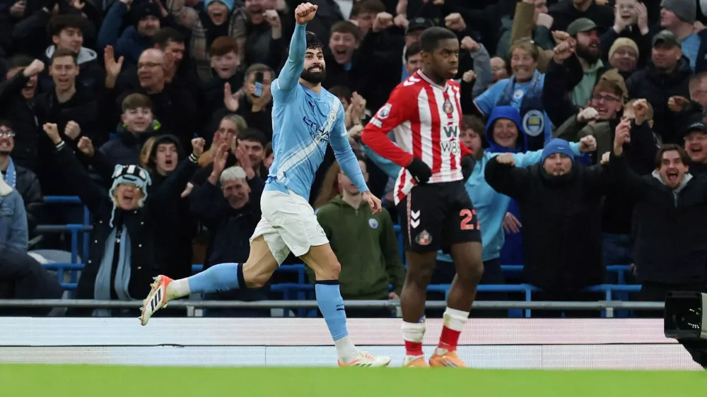 Soccer Football - Premier League - Manchester City v Sunderland - Etihad Stadium, Manchester, Britain - December 6, 2025 Manchester City's Josko Gvardiol celebrates scoring their second goal REUTERS/Phil Noble EDITORIAL USE ONLY. NO USE WITH UNAUTHORIZED AUDIO, VIDEO, DATA, FIXTURE LISTS, CLUB/LEAGUE LOGOS OR 'LIVE' SERVICES. ONLINE IN-MATCH USE LIMITED TO 120 IMAGES, NO VIDEO EMULATION. NO USE IN BETTING, GAMES OR SINGLE CLUB/LEAGUE/PLAYER PUBLICATIONS. PLEASE CONTACT YOUR ACCOUNT REPRESENTATIVE FOR FURTHER DETAILS. REFILE - CORRECTING EVENT