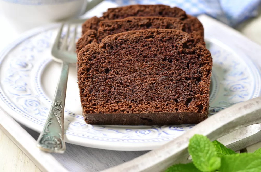 Chocolate banana cake for a breakfast on a wooden tray.