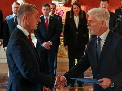 Czech President Petr Pavel shakes hands with the ANO party leader Andrej Babis on the day of appointing him as the country's new Prime Minister at Prague Castle in Prague, Czech Republic December 9, 2025. REUTERS/Eva Korinkova