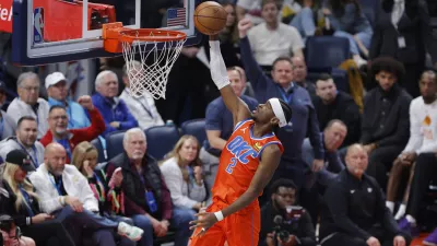 Dec 10, 2025; Oklahoma City, Oklahoma, USA; Oklahoma City Thunder guard Shai Gilgeous-Alexander (2) goes up for a basket against the Phoenix Suns during the third quarter at Paycom Center. Mandatory Credit: Alonzo Adams-Imagn Images