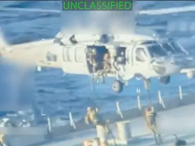 U.S. forces abseil onto an oil tanker during a raid described by U.S. Attorney General Pam Bondi as its seizure by the United States off the coast of Venezuela, December 10, 2025, in a still image from video. U.S. Attorney General/Handout via REUTERS. THIS IMAGE HAS BEEN SUPPLIED BY A THIRD PARTY. SELECTIVE BLURRING FROM SOURCE.