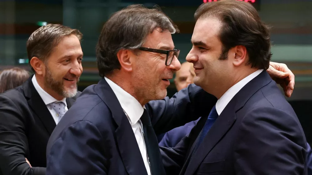 Greek Finance Minister Kyriakos Pierrakakis, Slovenia's Minister for Finance Klemen Bostjancic and Italian Economy and Finance Minister Giancarlo Giorgetti attend a Eurogroup Finance Ministers meeting in Brussels, Belgium December 11, 2025. REUTERS/Yves Herman