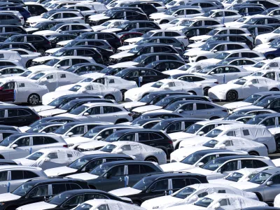 Cars are lined up before being loaded onto ships in the port at BLG Autoterminal Bremerhaven, Germany, Tuesday, April 1, 2025. (Sina Schuldt/dpa via AP)