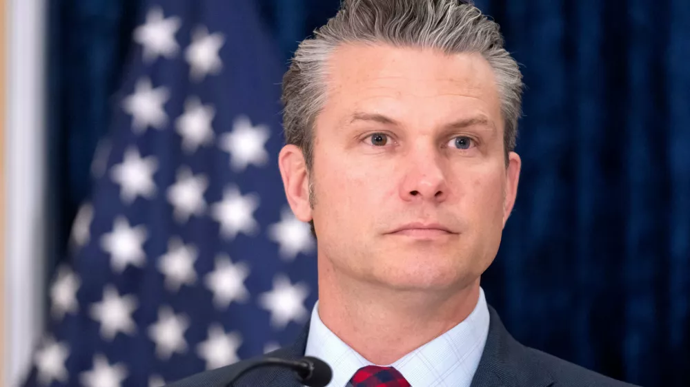 Secretary of Defense Pete Hegseth listens during remarks on the sidelines of the AUKUS Defense Ministers' Ministerial meeting at the Pentagon, Wednesday, Dec. 10, 2025, in Washington. (AP Photo/Mark Schiefelbein)