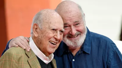 FILE - Carl Reiner, left, and his son Rob Reiner pose together following their hand and footprint ceremony at the TCL Chinese Theatre, April 7, 2017, in Los Angeles. (Photo by Chris Pizzello/Invision/AP, File)