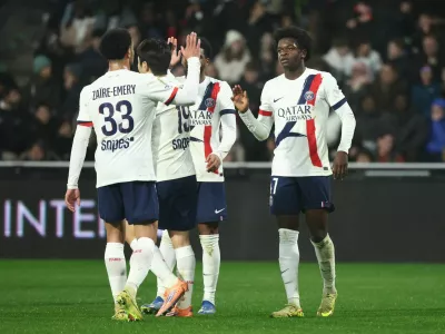 Soccer Football - Ligue 1 - FC Metz v Paris St Germain - Stade Saint-Symphorien, Metz, France - December 13, 2025 Paris St Germain's Quentin Ndjantou celebrates scoring their second goal with teammates REUTERS/Catherine Steenkeste