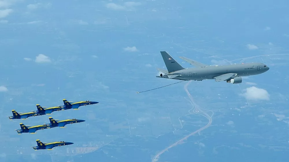 A KC-46 Pegasus assigned to the 931st Air Refueling Wing, McConnell Air Force Base, Kan., lines up to refuel an U.S. Navy Blue Angels F/A-18 Hornet, July 1, 2020 over South Dakota. This marks the first time the 931st ARW refueled the Blue Angels using a KC-46. The KC-46 represents the beginning of a new era in air-to-air refueling capability to support the U.S. Air Force, Navy and Marine Corps. The modernized fly-by-wire boom provides a larger air-refueling envelope than the KC-46's predecessor, the KC-135 Stratotanker. In addition to the boom, the aircraft is capable of refueling through drogue and wing aerial fueling pods, or WARPs, to provide simultaneous multi-point air refueling. (U.S. Air Force photo by Maj. Andrea Morris)