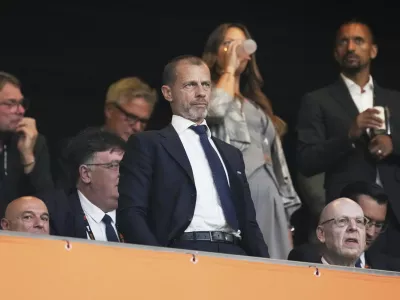 UEFA President Aleksander Ceferin, center, attends during the Europa League final soccer match between Tottenham Hotspur and Manchester United at the San Mames Stadium in Bilbao, Spain, Wednesday, May 21, 2025. (AP Photo/Jose Breton)