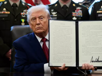 U.S. President Donald Trump shows a signed executive order classifying fentanyl as 'weapon of mass destruction' during a Mexican Border Defense Medal presentation in the Oval Office at the White House in Washington, D.C., U.S., December 15, 2025. REUTERS/Evelyn Hockstein