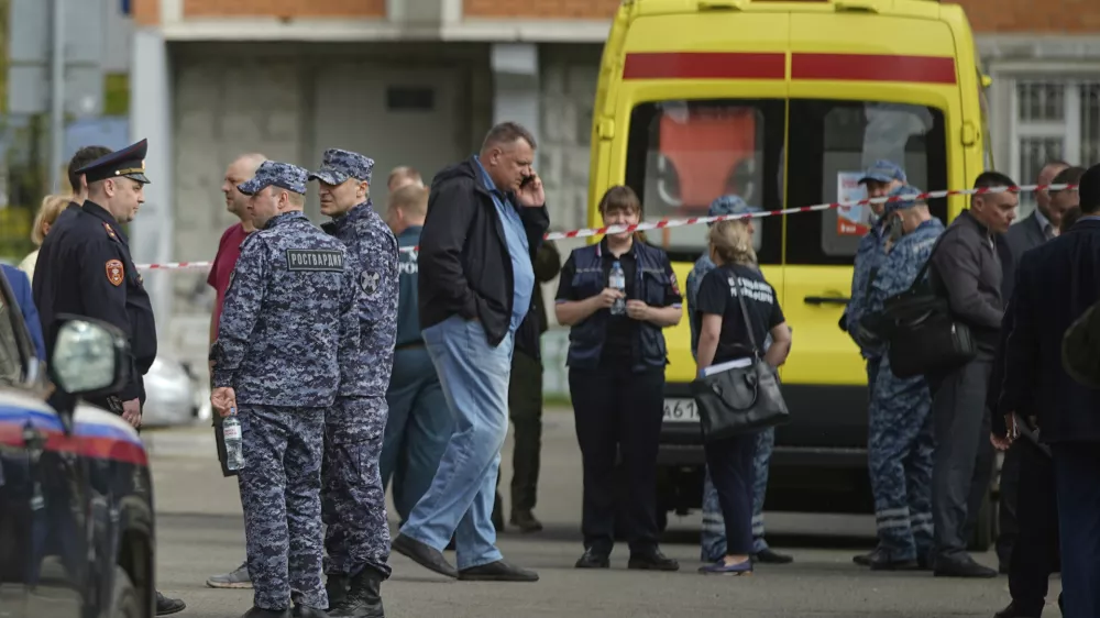 Police and investigators work at the scene where Lt. Gen. Yaroslav Moskalik, a deputy head of the main operational department in the General Staff of the Russian armed forces, was killed by an explosive device placed in his car in Balashikha, just outside Moscow, Russia, on Friday, April 25, 2025. (AP Photo)