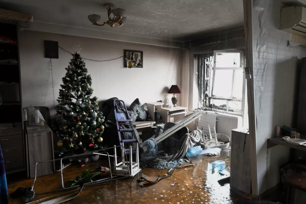 A Christmas tree remains in the living room damaged by a Russian drone strike, Zaporizhzhia, Ukraine, December 16, 2025. Russian troops attacked a nine-storey apartment building with a drone, starting a fire in several flats and injuring three people. (Photo by Dmytro Smolienko/Ukrinform) (Photo by Ukrinform/Ukrinform/Sipa USA)No Use Russia.