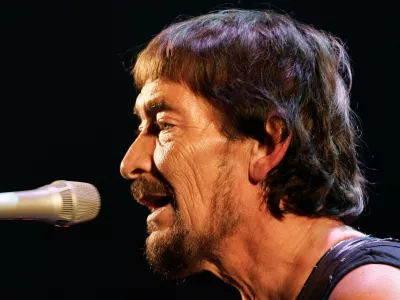 FILE - British rock musician Chris Rea performs during his first German concert of "The Return of the Fabulous Bluenotes" tour in Munich, Germany, on Feb. 7, 2008. (AP Photo/Christof Stache, File)