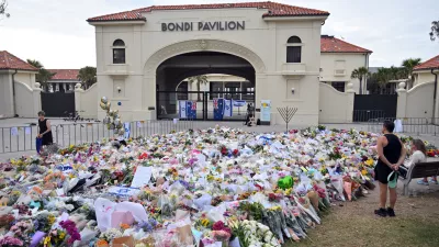 17 December 2025, Australia, Sydney: Flowers are seen at a makeshift memorial at the Bondi Pavillion following a shooting at Bondi Beach. Australia is in mourning after gunmen opened fire on Bondi Beach, killing 15 people in an attack designed to target the Jewish community. Photo: Mick Tsikas/AAP/dpa
