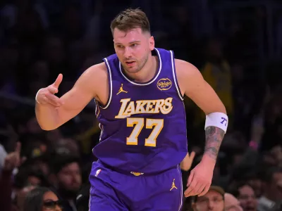 Dec 10, 2025; Los Angeles, California, USA; Los Angeles Lakers guard Luka Doncic (77) reacts after a 3-point basket during the first half against the San Antonio Spurs at Crypto.com Arena. Mandatory Credit: Jayne Kamin-Oncea-Imagn Images