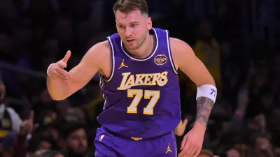 Dec 10, 2025; Los Angeles, California, USA; Los Angeles Lakers guard Luka Doncic (77) reacts after a 3-point basket during the first half against the San Antonio Spurs at Crypto.com Arena. Mandatory Credit: Jayne Kamin-Oncea-Imagn Images