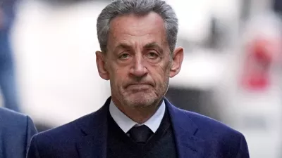 FILE - Former French President Nicolas Sarkozy leaves his home Tuesday, Oct. 21, 2025 in Paris as he heads to prison to serve time for a criminal conspiracy to finance his 2007 election campaign with funds from Libya. (AP Photo/Thibault Camus, File)