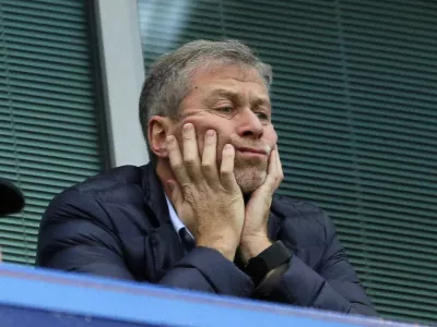 FILE - Chelsea soccer club owner Roman Abramovich sits in his box before their English Premier League soccer match against Sunderland at Stamford Bridge stadium in London, Dec. 19, 2015. Chelsea owner Roman Abramovich has on Saturday, Feb. 26, 2022 suddenly handed over the &acirc;&euro;śstewardship and care&acirc;&euro;ť of the Premier League club to its charitable foundation trustees. The move came after a member of the British parliament called for the Russian billionaire to hand over the club in the wake of Russia&acirc;&euro;&trade;s invasion of Ukraine. (AP Photo/Matt Dunham, File)