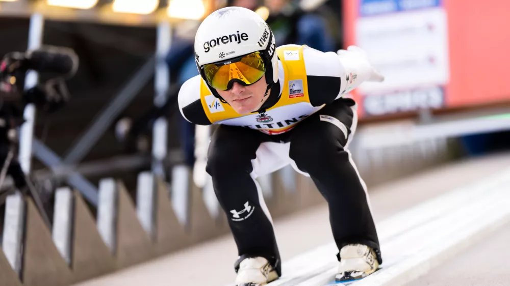 Domen Prevc of Slovenia speeds down the slope during the men's FIS Ski Jumping World Cup competition at the Gross-Titlis Schanze, in Engelberg, Switzerland, Saturday, Dec. 20, 2025. (Urs Flueeler/Keystone via AP)