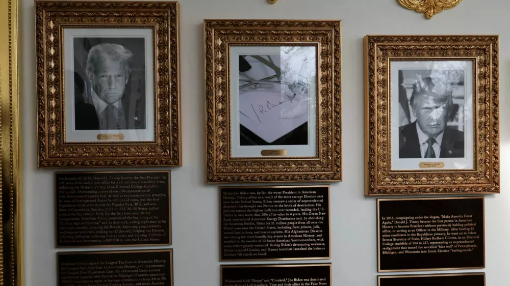 Portraits of U.S President Donald Trump flank an image of an autopen signing former U.S. President Joe Biden's signature in place of a portrait of Biden on the "Presidential Walk of Fame" along the White House Colonnade in Washington, D.C., U.S., December 17, 2025. REUTERS/Jessica Koscielniak