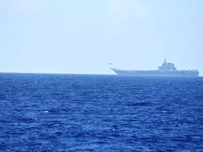 FILE PHOTO: A helicopter takes off from China's Shandong aircraft carrier, over Pacific Ocean waters, south of Okinawa prefecture, Japan, in this handout photo taken April 15, 2023 and released by the Joint Staff Office of the Defense Ministry of Japan April 17, 2023. Joint Staff Office of the Defense Ministry of Japan/HANDOUT via REUTERS ATTENTION EDITORS - THIS IMAGE WAS PROVIDED BY A THIRD PARTY. MANDATORY CREDIT./File Photo