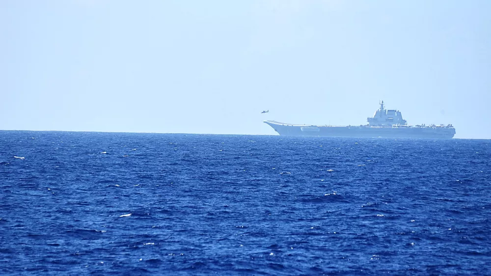 FILE PHOTO: A helicopter takes off from China's Shandong aircraft carrier, over Pacific Ocean waters, south of Okinawa prefecture, Japan, in this handout photo taken April 15, 2023 and released by the Joint Staff Office of the Defense Ministry of Japan April 17, 2023. Joint Staff Office of the Defense Ministry of Japan/HANDOUT via REUTERS ATTENTION EDITORS - THIS IMAGE WAS PROVIDED BY A THIRD PARTY. MANDATORY CREDIT./File Photo