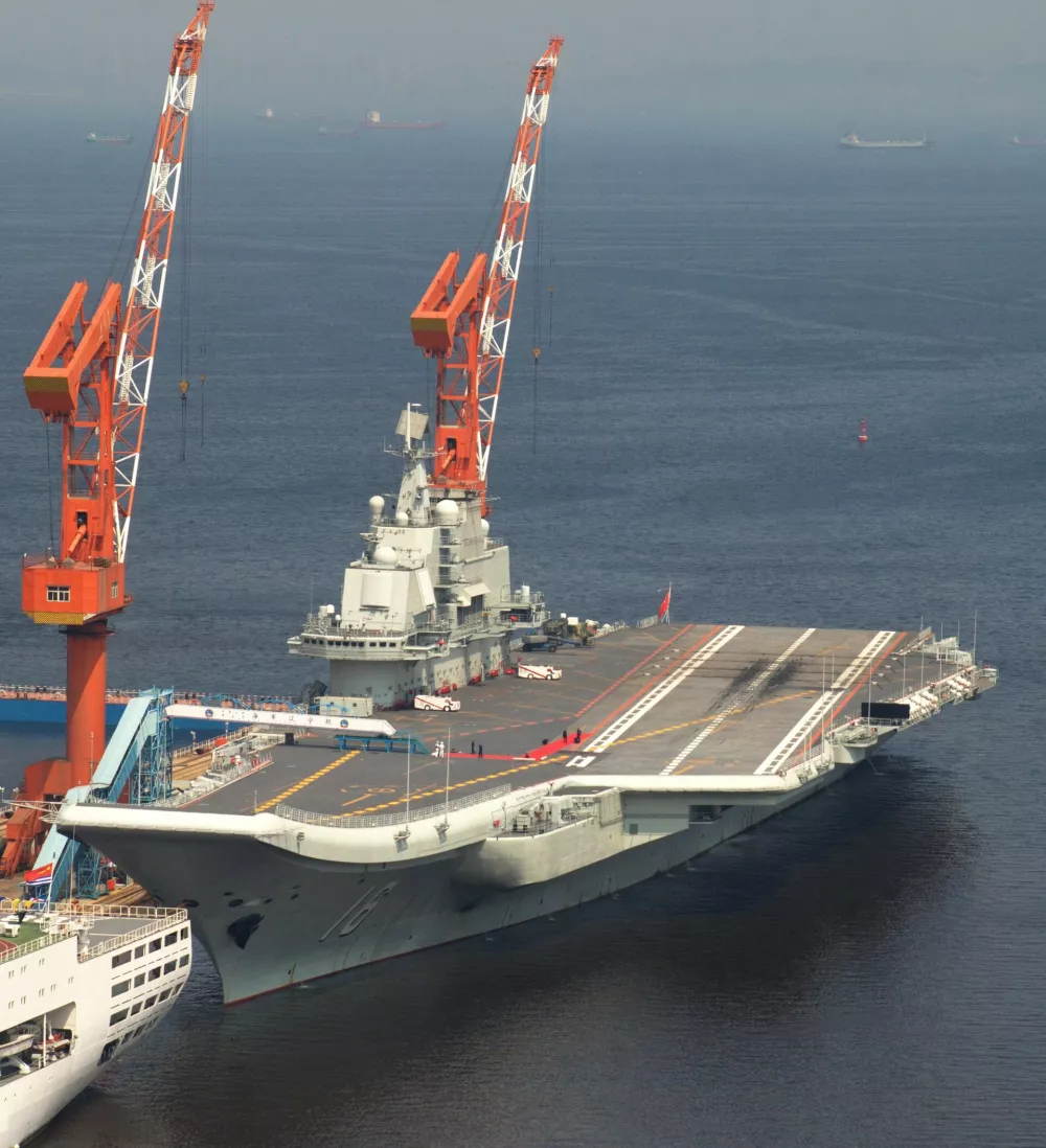 Chinese aircraft carrier The Liaoning is anchored at the quay of a shipyard in Dalian city, northeast Chinas Liaoning province, 25 August 2013.Chinas first aircraft carrier The Liaoning returned to the shipyard where it was refitted in Dalian, northeast Chinas Liaoning province on Friday (23 August 2013). It was the first time for the warship to come back to the port since it left for its homeport in February. Some problems found during the operation of The Liaoning over the past months would be resolved, such as ship structures, power systems, onboard equipment, weapons, etc., according to analysis of military experts. There would also be some ceremonies to welcome senior military officials, according to media reports.(Imaginechina via AP Images)