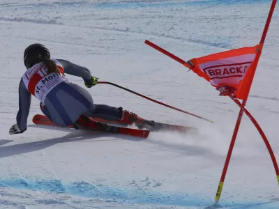 Italy's Sofia Goggia speeds down the course during an alpine ski, women's World Cup super G in St. Moritz, Switzerland, Saturday, Dec. 14, 2019. (AP Photo/Alessandro Trovati)