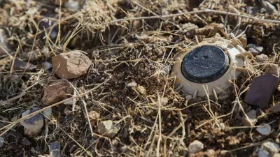 A landmine uncovered by Hoshyar Ali remains partially buried in rocky soil in Halabja, Iraq, on November 20, 2025. He has been clearing landmines for over four decades, a task he began after the Iran-Iraq war when thousands of mines were planted along the border. Despite losing both legs and several family members to explosions, he continues to volunteer in mine removal. Locals call him "man of the mines," and he is building a museum in his village to display defused explosives for future generations.//MIDDLEEASTIMAGES_MEI799/Credit:Showan Sulaiman/MEI/SIPA/2511231254,Image: 1054149849, License: Rights-managed, Restrictions:, Model Release: no