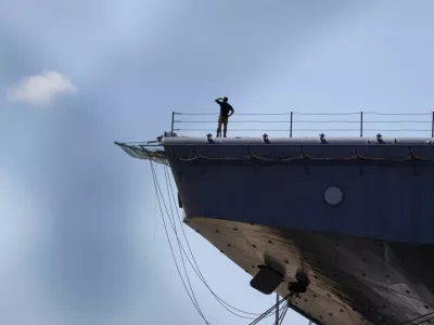 Personnel stands on the flight deck of the amphibious assault ship USS Iwo Jima (LHD-7) while the vessel is docked in Ponce amid ongoing military movements in Puerto Rico, December 17, 2025. REUTERS/Eva Marie Uzcategui