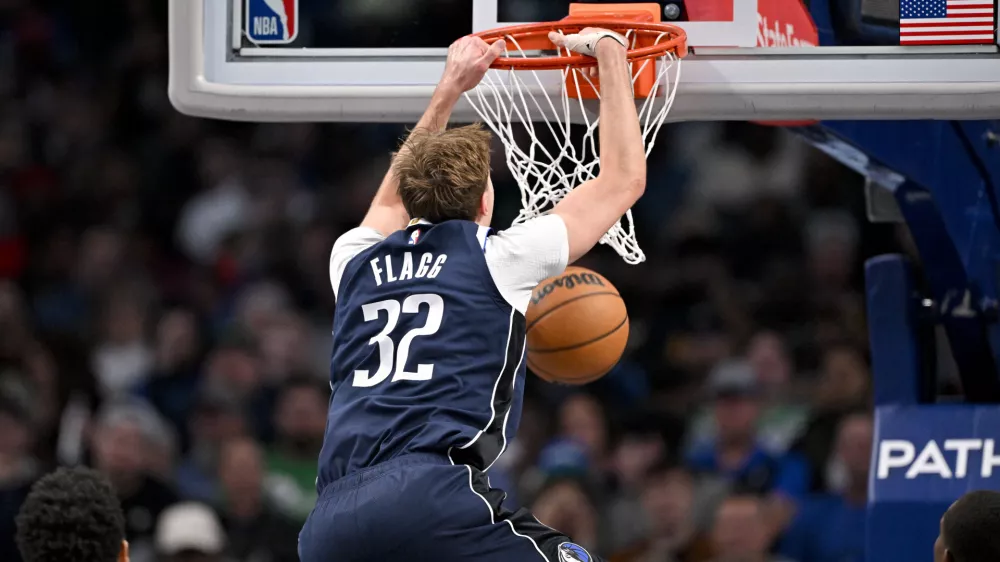 Dec 18, 2025; Dallas, Texas, USA; Dallas Mavericks forward Cooper Flagg (32) dunks the ball against the Detroit Pistons during the second half at the American Airlines Center. Mandatory Credit: Jerome Miron-Imagn Images
