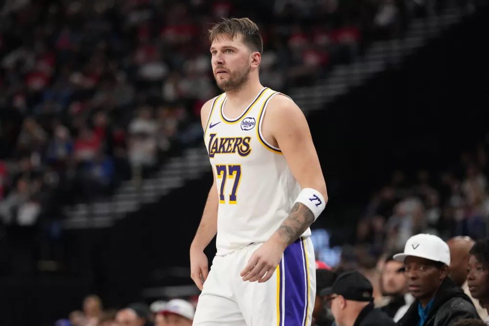 Dec 20, 2025; Inglewood, California, USA; Los Angeles Lakers forward/guard Luka Dončić (77) reacts against the LA Clippers in the first half at Intuit Dome. Mandatory Credit: Kirby Lee-Imagn Images