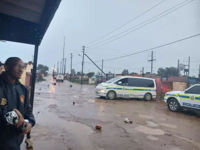 Police cars block a street near the scene after an early morning shooting in Bekkersdal township south-west of Johannesburg, South Africa, December 21, 2025. South African Police Services/Handout via REUTERS. ATTENTION EDITORS &ndash; THIS IMAGE HAS BEEN SUPPLIED BY A THIRD PARTY.